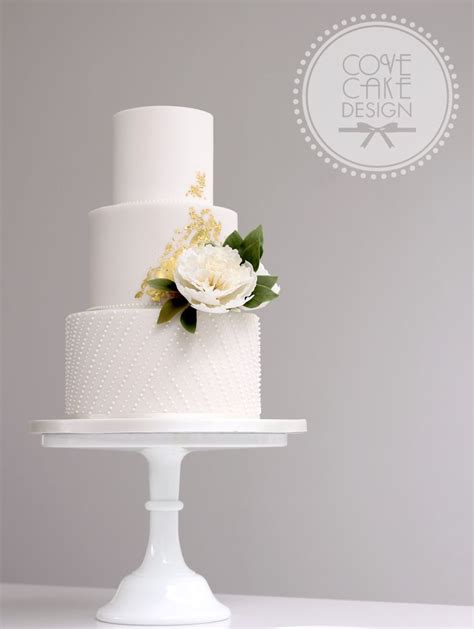 White Fondant Wedding Cake With Frilly Sugar Peony Royal Icing Beading