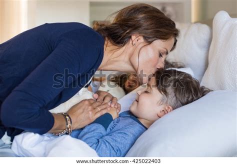 Mother Giving Good Night Kiss Sleeping Stock Photo Edit Now 425022403