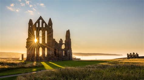 No place in england is more than 75 miles (120 km) from the sea, and even the farthest points in the country are no more than a day's journey by road or rail from london. sunset on whitby abbey castle in england hd travel ...