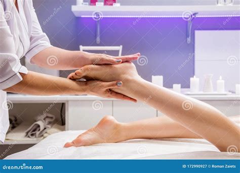 Beautiful Young Woman Enjoying Foot Massage In Spa Salon Cosmetology Stock Image Image Of
