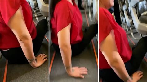 woman forced to crawl down plane aisle flipboard