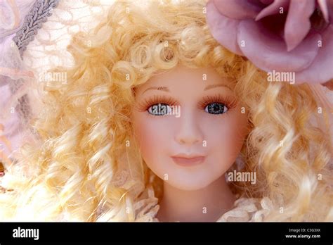 Antique Old Blond Porcelain Doll Face Portrait Curly Hair Stock Photo