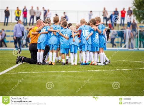 Children Soccer Football Team With Coach Group Of Kids Standing