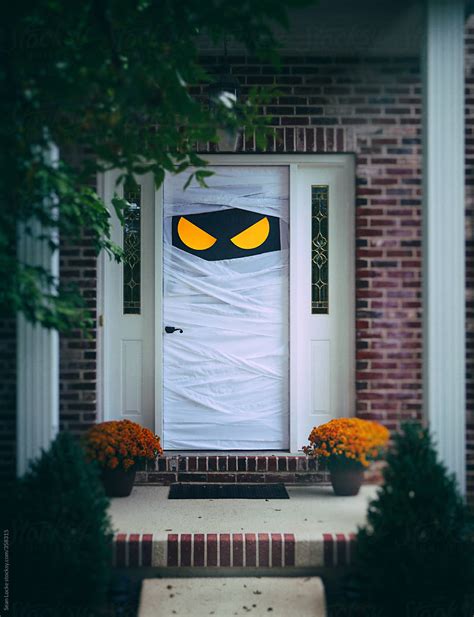 Spooky Halloween Door Wrapped Up As Mummy By Stocksy Contributor