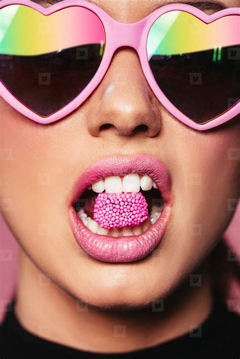 Beautiful Woman Holding Candy In Mouth Stock Photo 125085