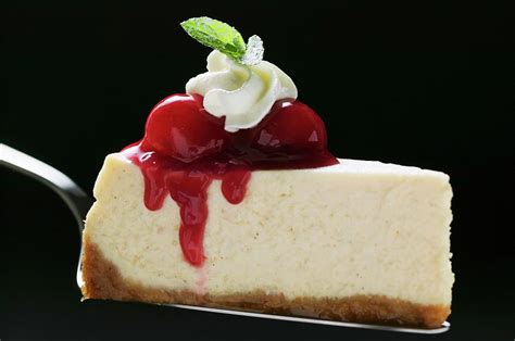 Slice Of Cheesecake With Cherries Cream Mint On Cake Server