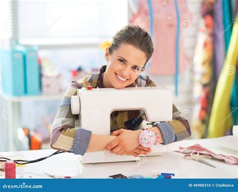 Happy Seamstress Embracing Sewing Machine Stock Photo Image Of Modern