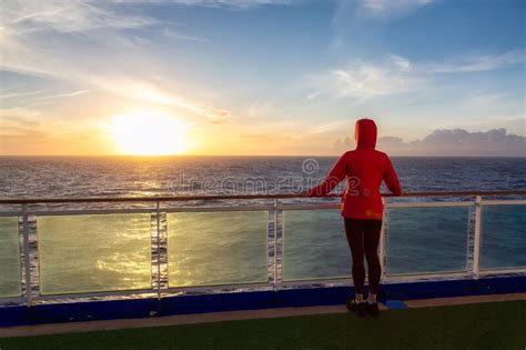 Adventure Woman Traveler Enjoying Colorful Sunset From A Cruise Ship