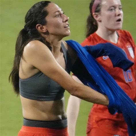 why did christenpress strip down to her sports bra on the field after the game last night