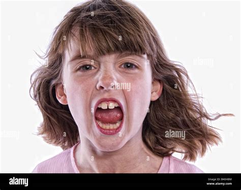 Young Angry Girl With Mouth Open Yelling Isolated On White Background