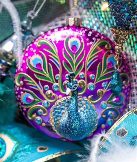 Peacock Ornaments Are On Display In A Shop Window With Feathers And