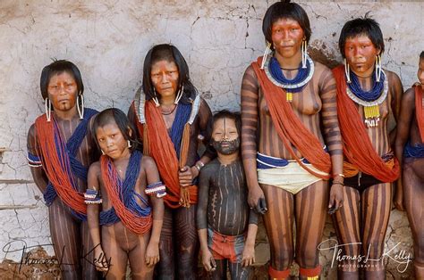 Kayapo People With Red Paints On Their Face Brazilians Style Photo
