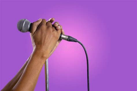 Hand Holding A Microphone On A Stand Stock Photo Image Of Microphone