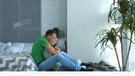 Romantic Couple In Love Embrace Sitting On Floor Stock Video Footage