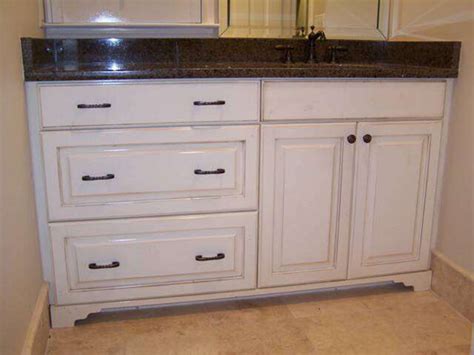 This bath cabinet is narrow to fit in your powder room, guest bath or master suite yet roomy enough to provide ample storage for toiletries and other items you'd like to keep off of the counter and tucked. Distressed vanity - Traditional - Bathroom Vanities And ...