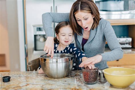 Mother Showing Daughter How To Make Chocolate Chip Cookies By Stocksy Contributor Jakob