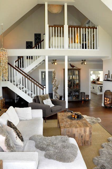 Living Room With Loft Overlooking It Neutrals And Natural Elements