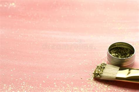 Pastel Pink Background With Gold Glitter And Brush Stock
