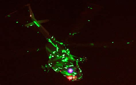 Protesters Illuminate Military Helicopter With Lasers Near The Presidential Palace In Cairo