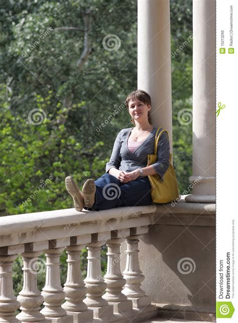 Woman Sits On Balcony Railing Stock Photo Image Of Relaxation Green