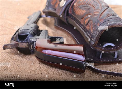 Close Up Of A Western Six Shooter Revolver With Leather Holster Stock