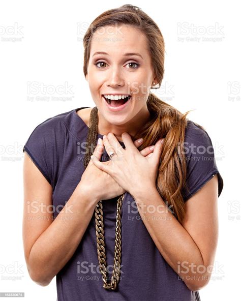 Excited Young Woman With Hands On Chest Stok Fotoğraflar And 20lerinde