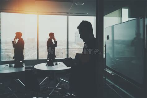 Silhouette Of Two Businessmen In Office Interior Stock Image Image Of