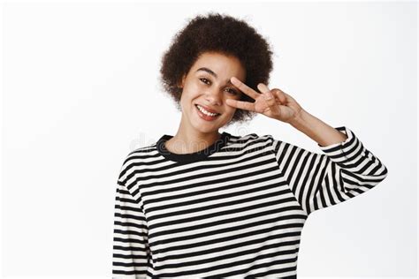 Positive Black Girl With Afro Hair Smiling And Looking Healthy
