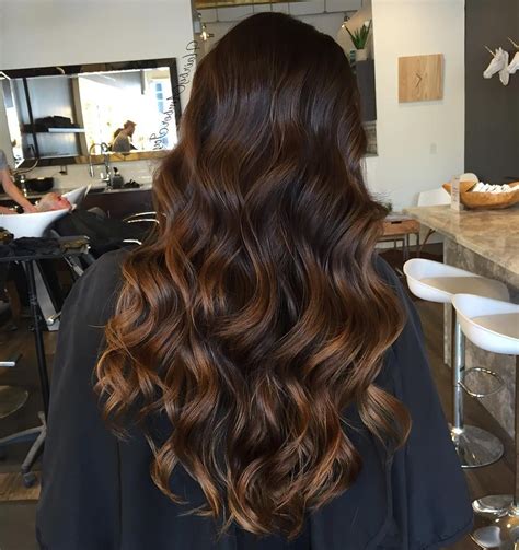 Focus light blonde caramel color on the outer layer and ends of hair and tousle it in with your darker roots. Caramel Highlights On Black Hairs 60 Balayage Hair Color ...
