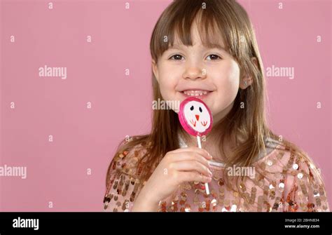 Young Happy Smiled Pretty Little Girl With Sweet Lollypop Candy