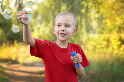 Boy Playing With Bubbles Stock Photo Image Of Carefree 67648390