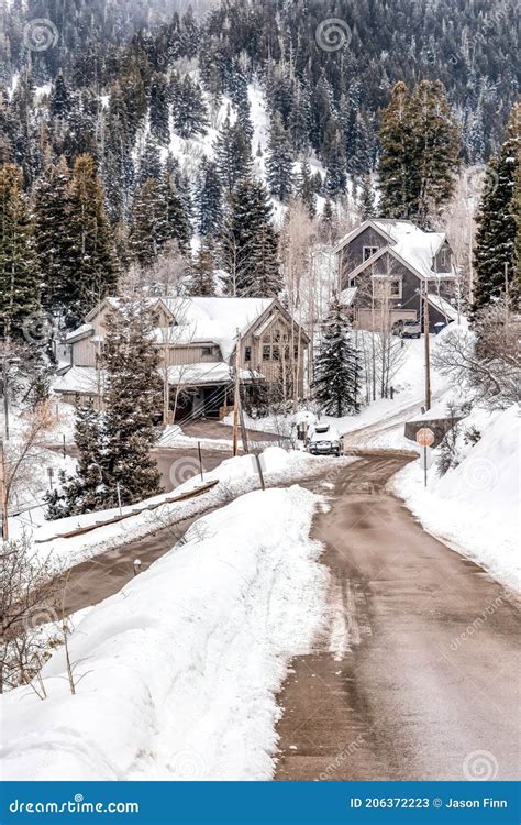 Road And Houses On A Scenic Neighborhood On A Snowy Mountain With