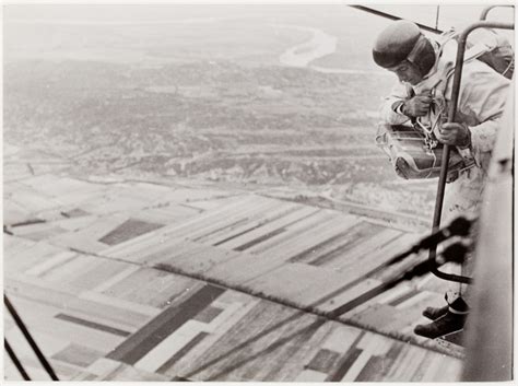 French Air Force Parachute Parachutist Jumping From A Plane At