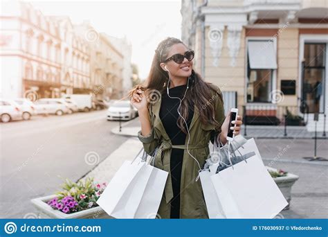 Joyful Lady In Stylish Sunglasses Spending Time In City Buying New