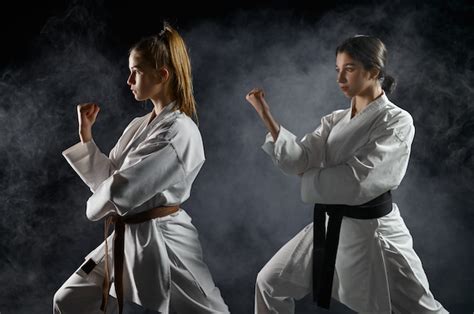 Premium Photo Female Karatekas Training In White Kimono Combat
