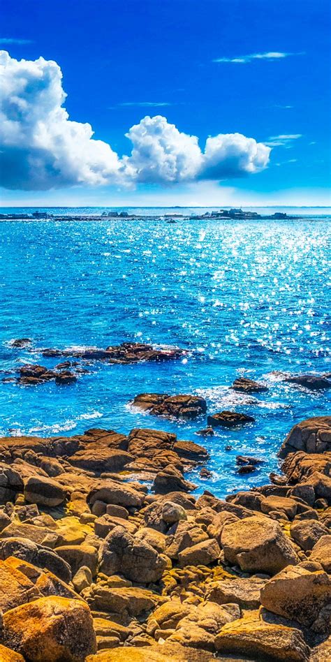 Download 1080x2160 Wallpaper Rocks Coast Sunny Day Blue Sea Honor