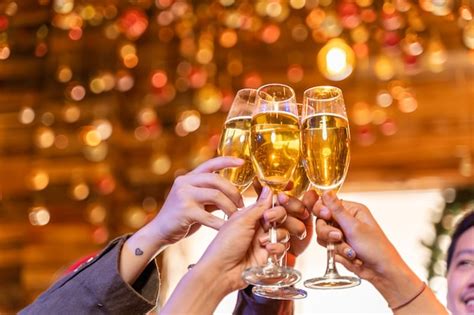 Premium Photo Close Up Glasses Of Clinking Glasses Of Champagne With Lighting Party With