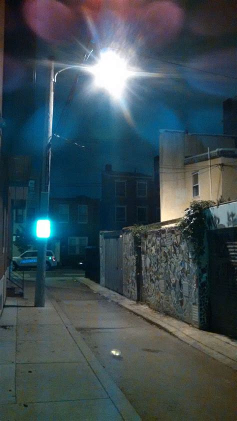 this streetlamp does a wonderful job of lighting my back alley but it also lights my library and