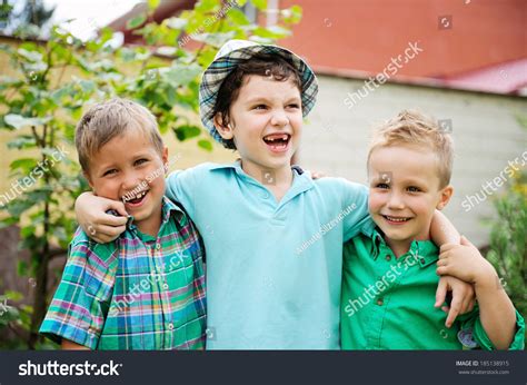 Three Happy Boys Standing Together Stock Photo 185138915 Shutterstock