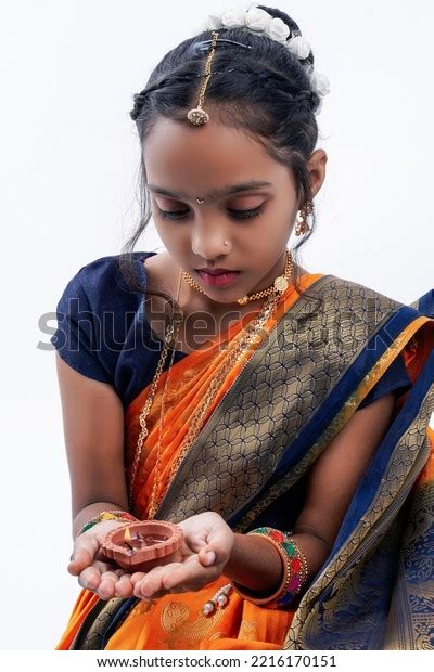 Cute Indian Maharashtrian Little Girl Holding Stock Photo 2216170151