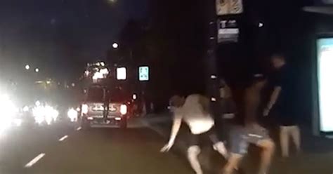 Shocking Video Shows Man Pushed Into Oncoming Traffic As Police Launch