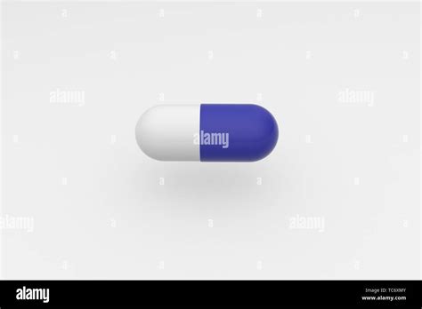 Single blue white pill on white background. Antibiotic in the capsule