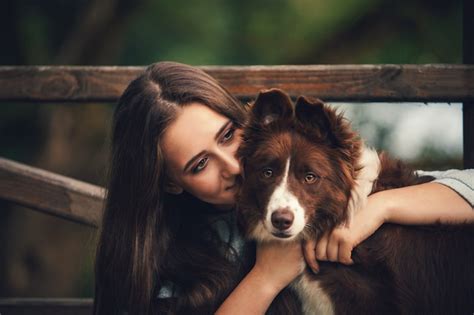 Premium Photo Girl Hugging A Dog