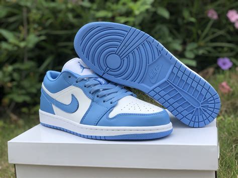 Starting at the top of the shoe is a clean white satin tongue, embellished with a blue jumpman logo. 2020 Release Air Jordan 1 Low "UNC" University Blue/White ...
