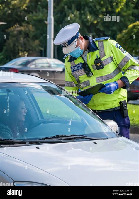Bucharest Romania Traffic Police Officer Writing A Ticket To A Female Driver Who Broke The Law