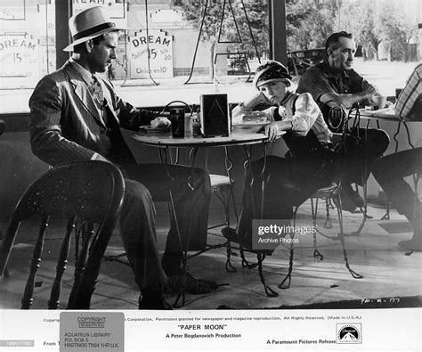 ryan o neal and tatum o neal sitting at a table at a cafe in a scene news photo getty images