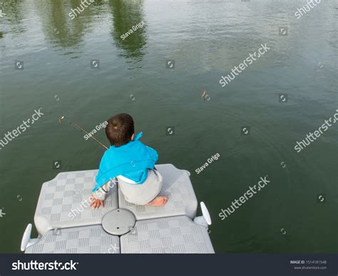 Young Boy Fishing Off Floating Dock Stock Photo 1514181548 Shutterstock