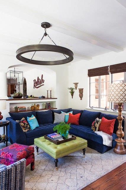 In this living room, a navy wall and sofa help to set off the pinks in the cushions, rug and artwork. Cozy Blue Sofas Giving Calm Impression in Interior Space ...