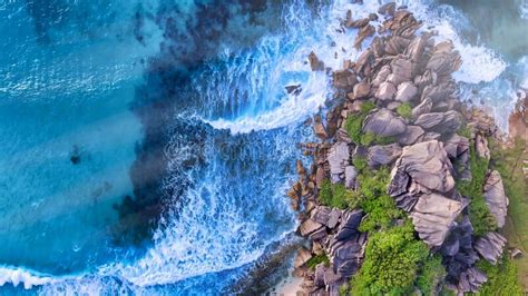 Amazing Overhead Aerial View Of Island Shoreline With Waves Along The