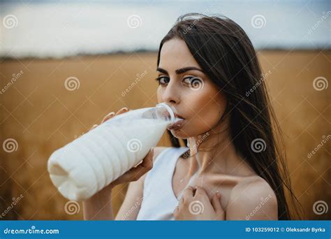 Beautiful Woman Is Drinking Milk In Countryside Stock Photo Image Of